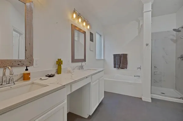a white toilet sitting next to a bathroom sink