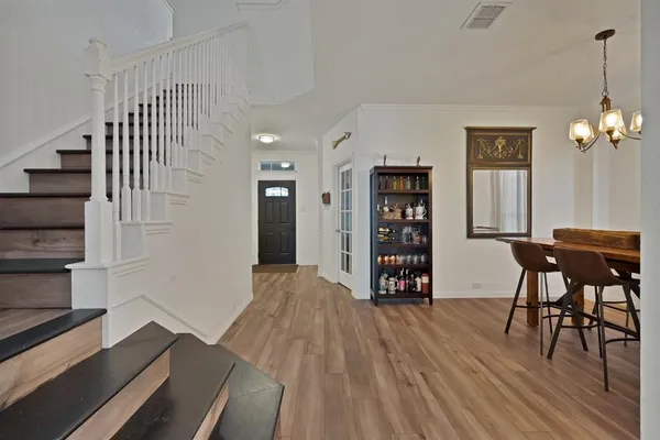 a view of a livingroom with furniture and wooden floor