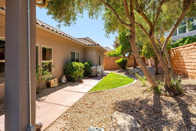 1609 East 10 S Street St. George, UT 84790 - Photo 57 of 68 Landscaped exterior featuring a stucco facade, tile roof, and a concrete pathway