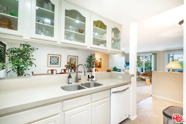 a kitchen with a sink and cabinets