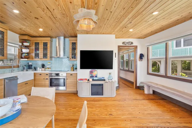 a view of living room with furniture and a fireplace