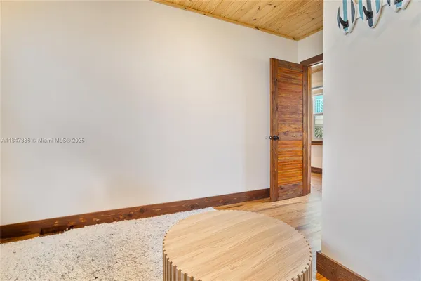 a bedroom with a large bed and a large window