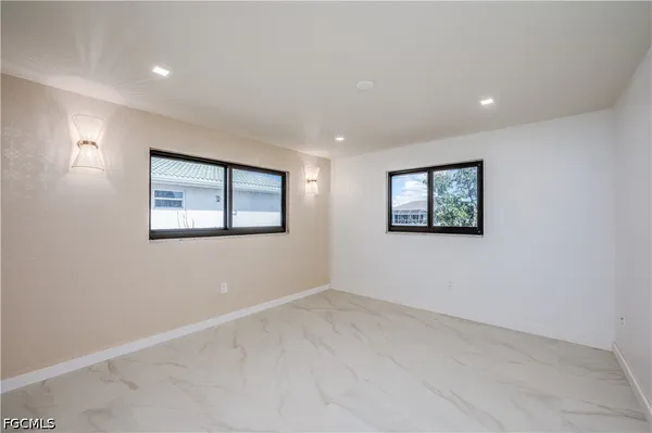 a view of empty room with windows