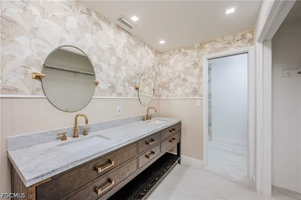 a bathroom with a mirror and a shower