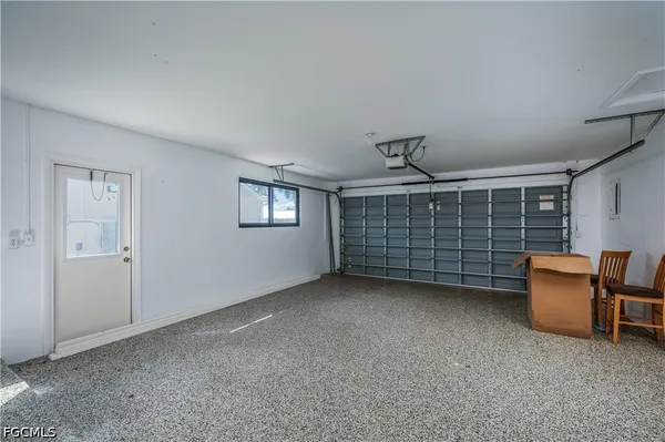 a view of an empty room with gym equipment