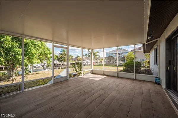 a view of a room with window and wooden floor