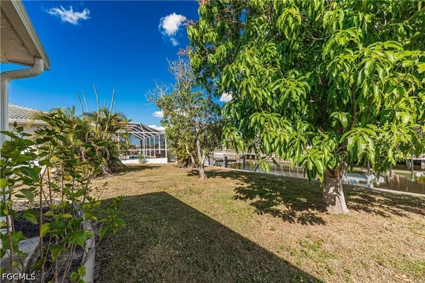 a view of a swimming pool with outdoor seating