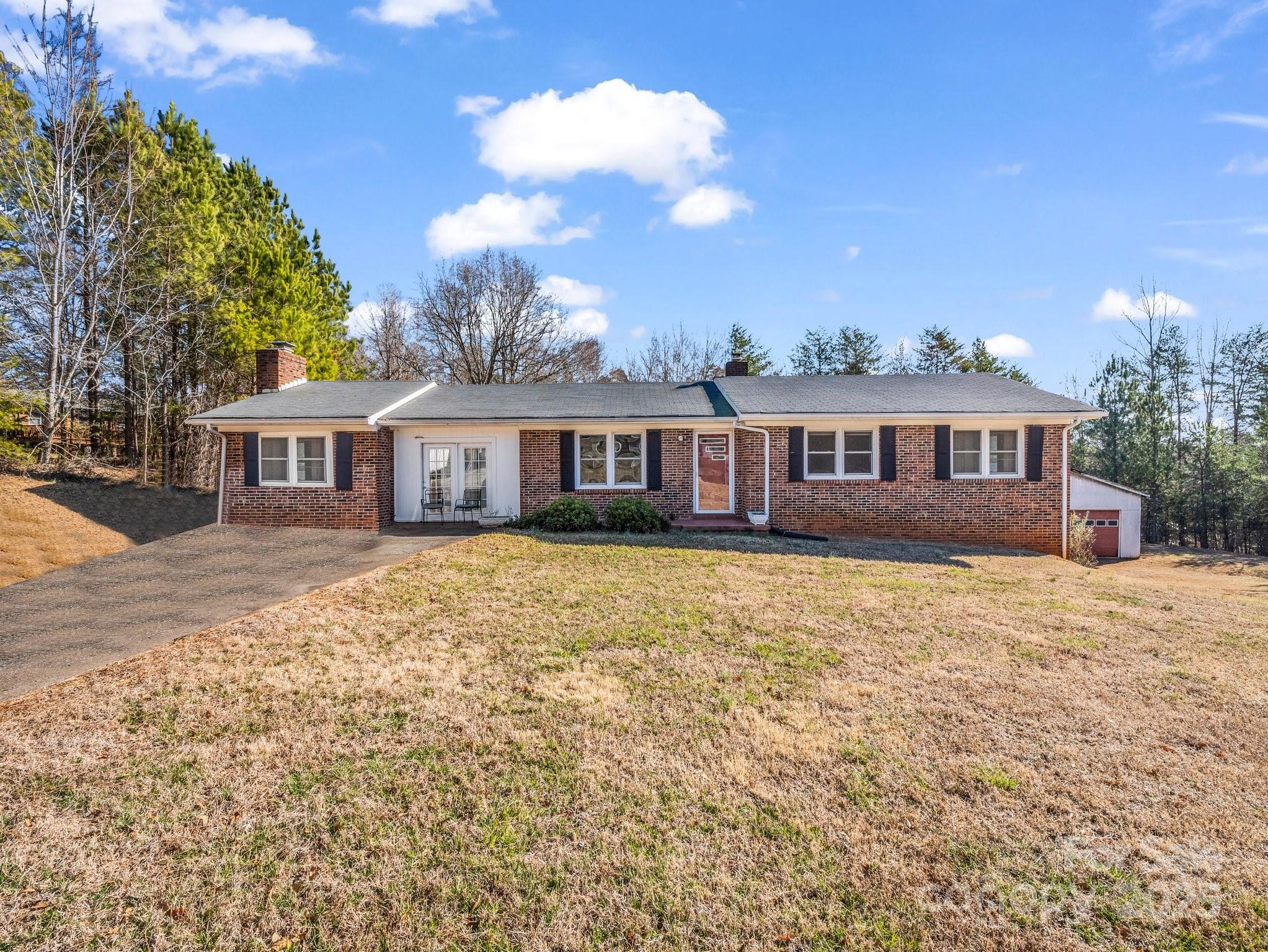 front view of a house with a yard