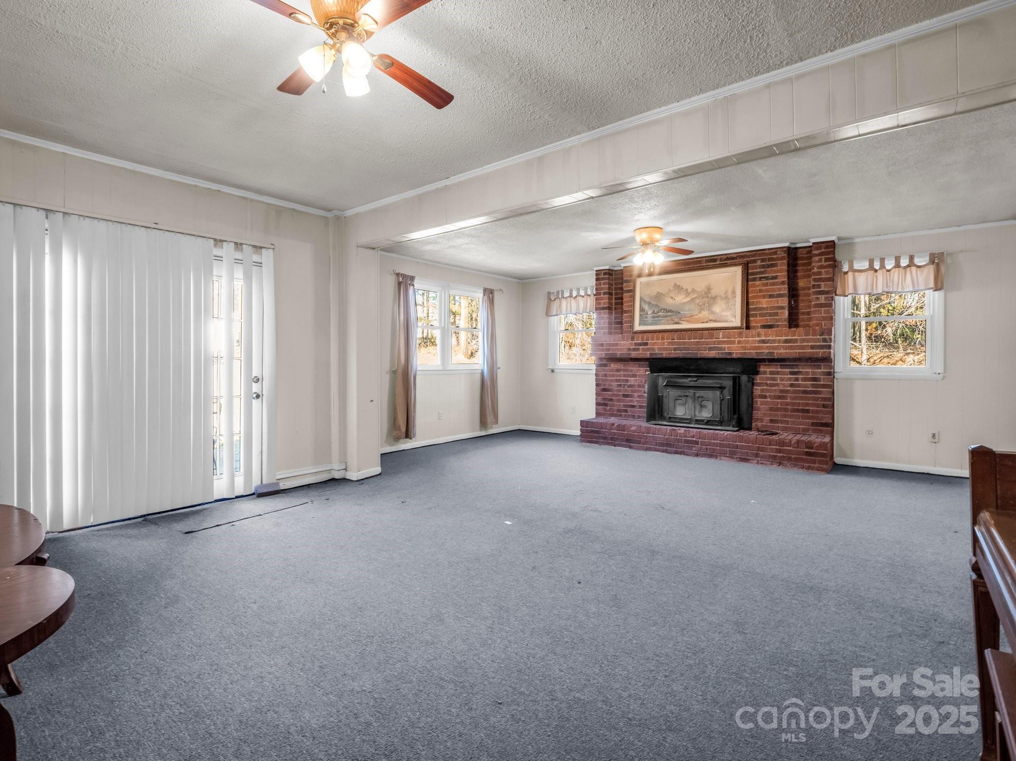 127 Mapp Street Spindale, NC 28160 - Photo 19 of 32 a view of a livingroom with a fireplace and window