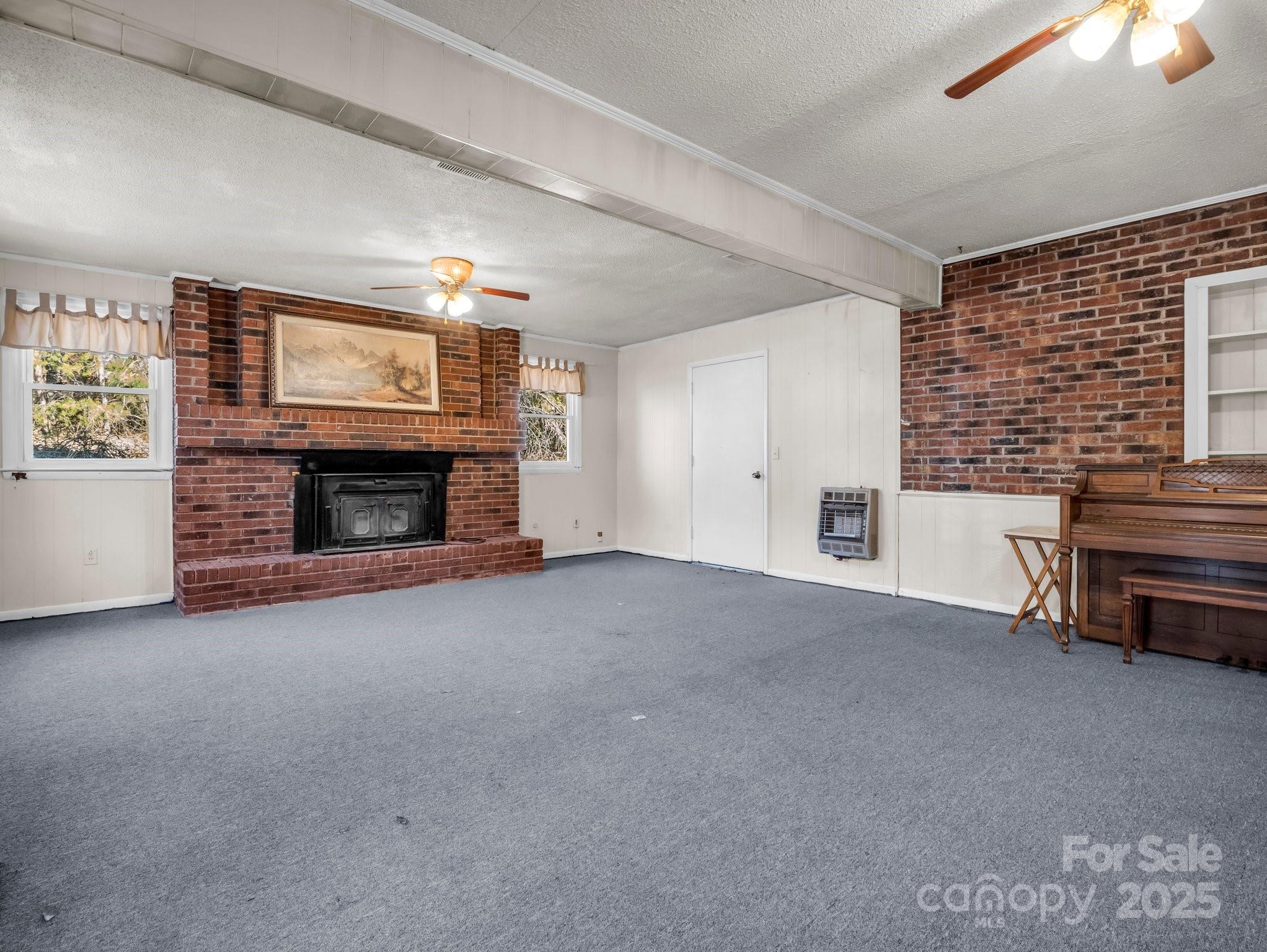 127 Mapp Street Spindale, NC 28160 - Photo 20 of 32 a view of empty room with furniture and a fireplace
