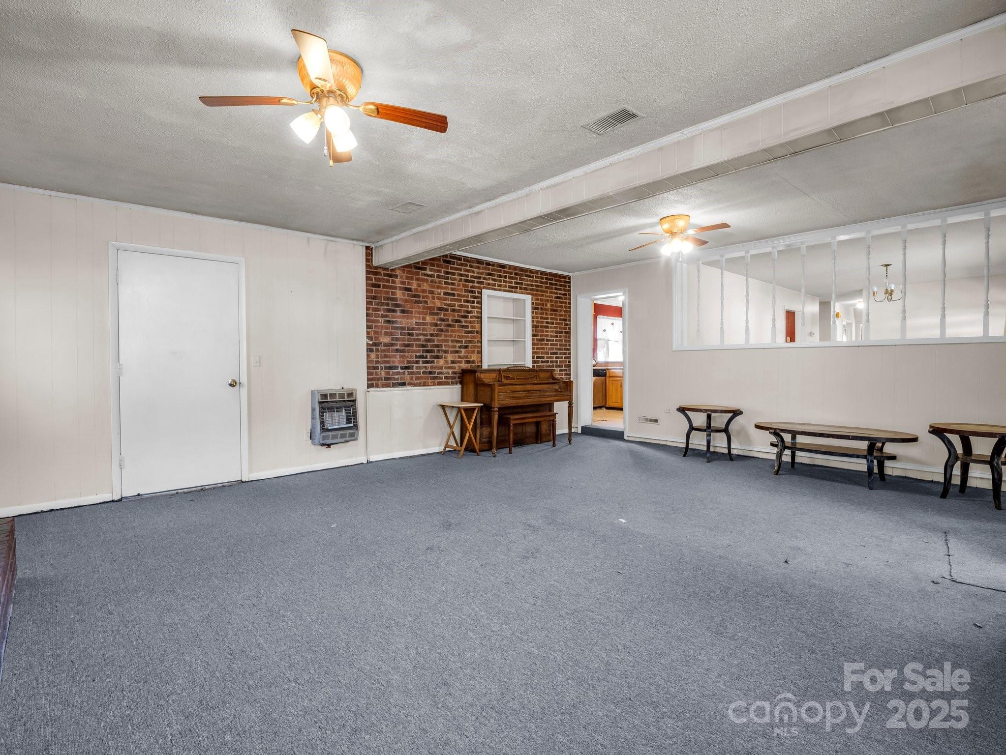 127 Mapp Street Spindale, NC 28160 - Photo 21 of 32 a view of a livingroom with furniture and a ceiling fan
