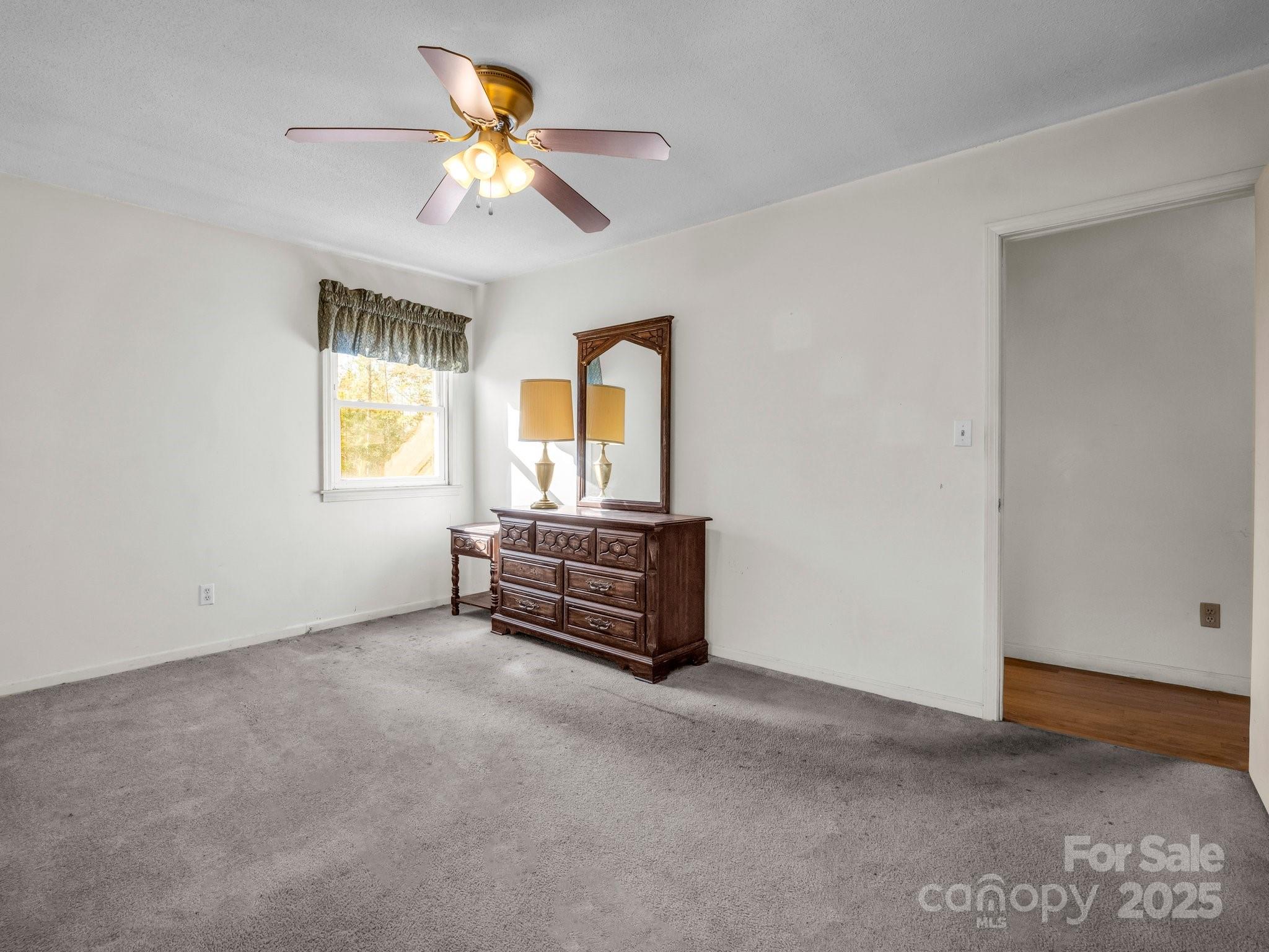 127 Mapp Street Spindale, NC 28160 - Photo 24 of 32 a room with chandelier fan and a window