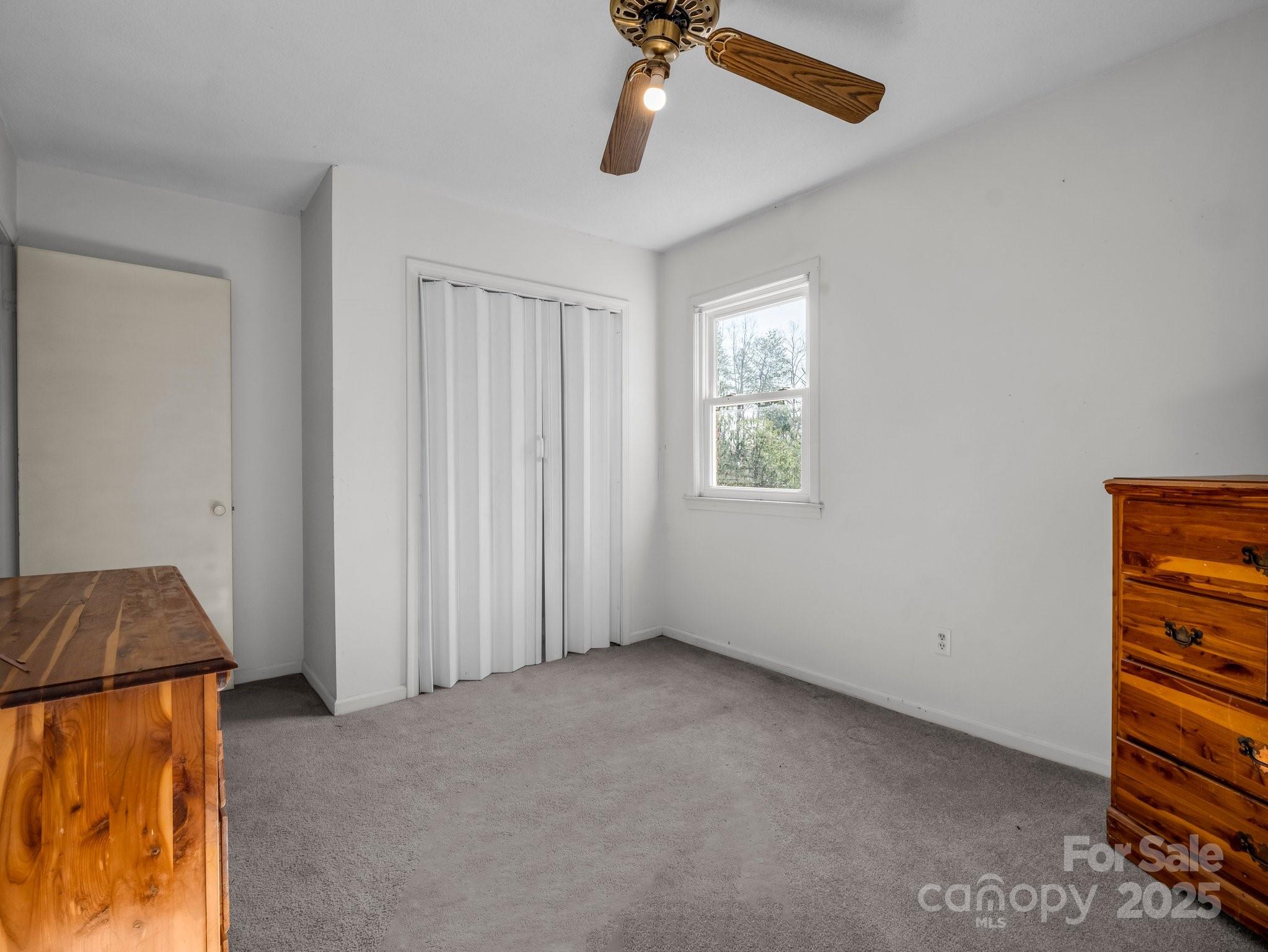 127 Mapp Street Spindale, NC 28160 - Photo 27 of 32 an empty room with windows and fan