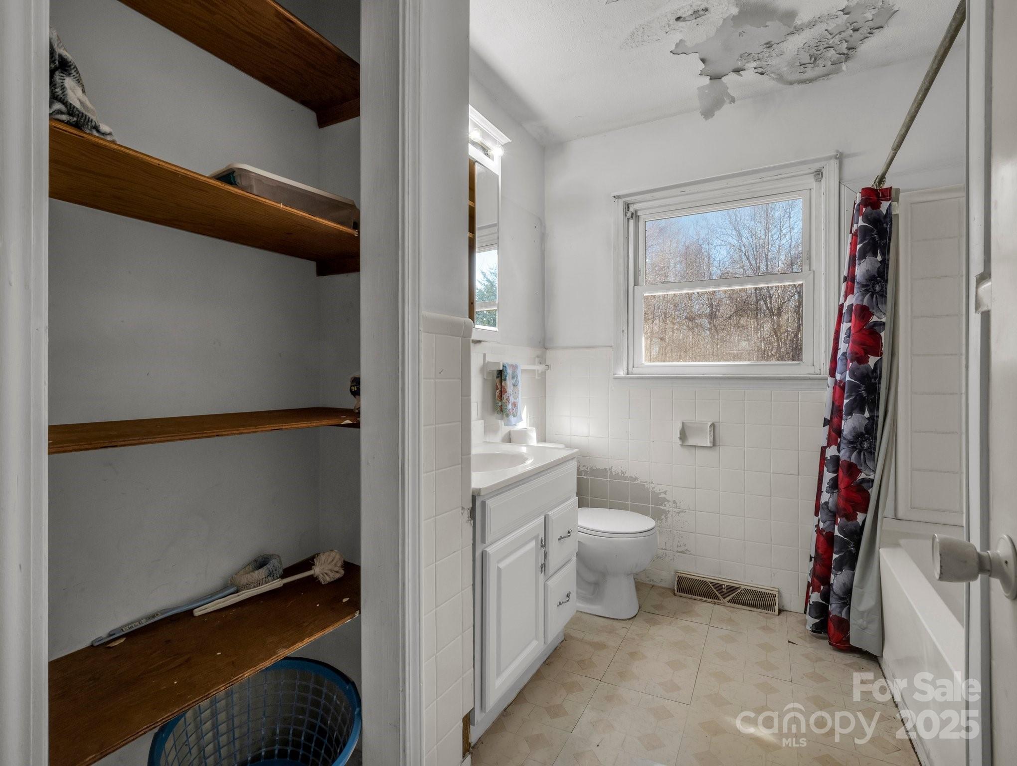 127 Mapp Street Spindale, NC 28160 - Photo 30 of 32 a bathroom with a toilet a sink and a shower