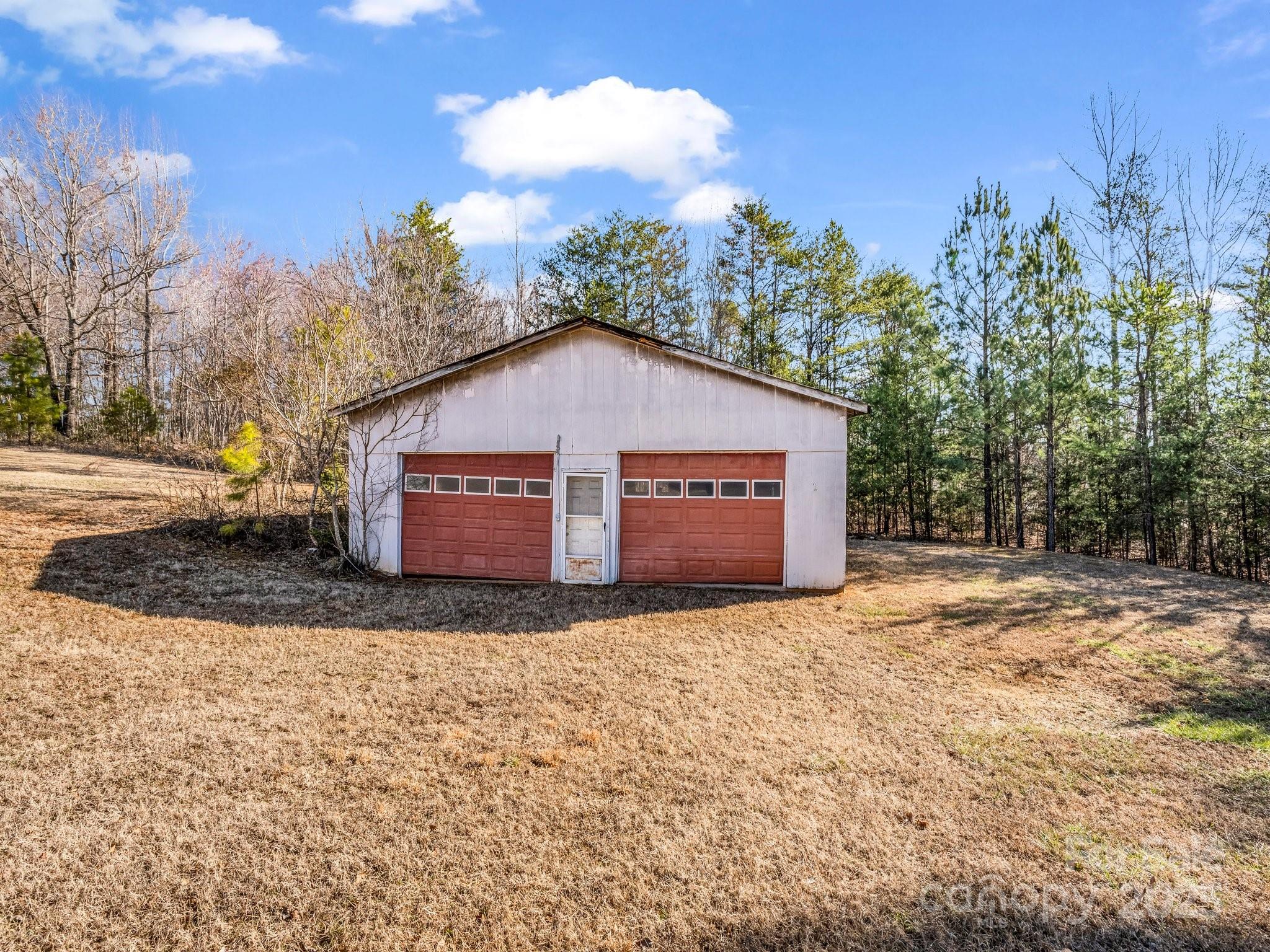 127 Mapp Street Spindale, NC 28160 - Photo 5 of 32 a view of a house with a yard and large trees