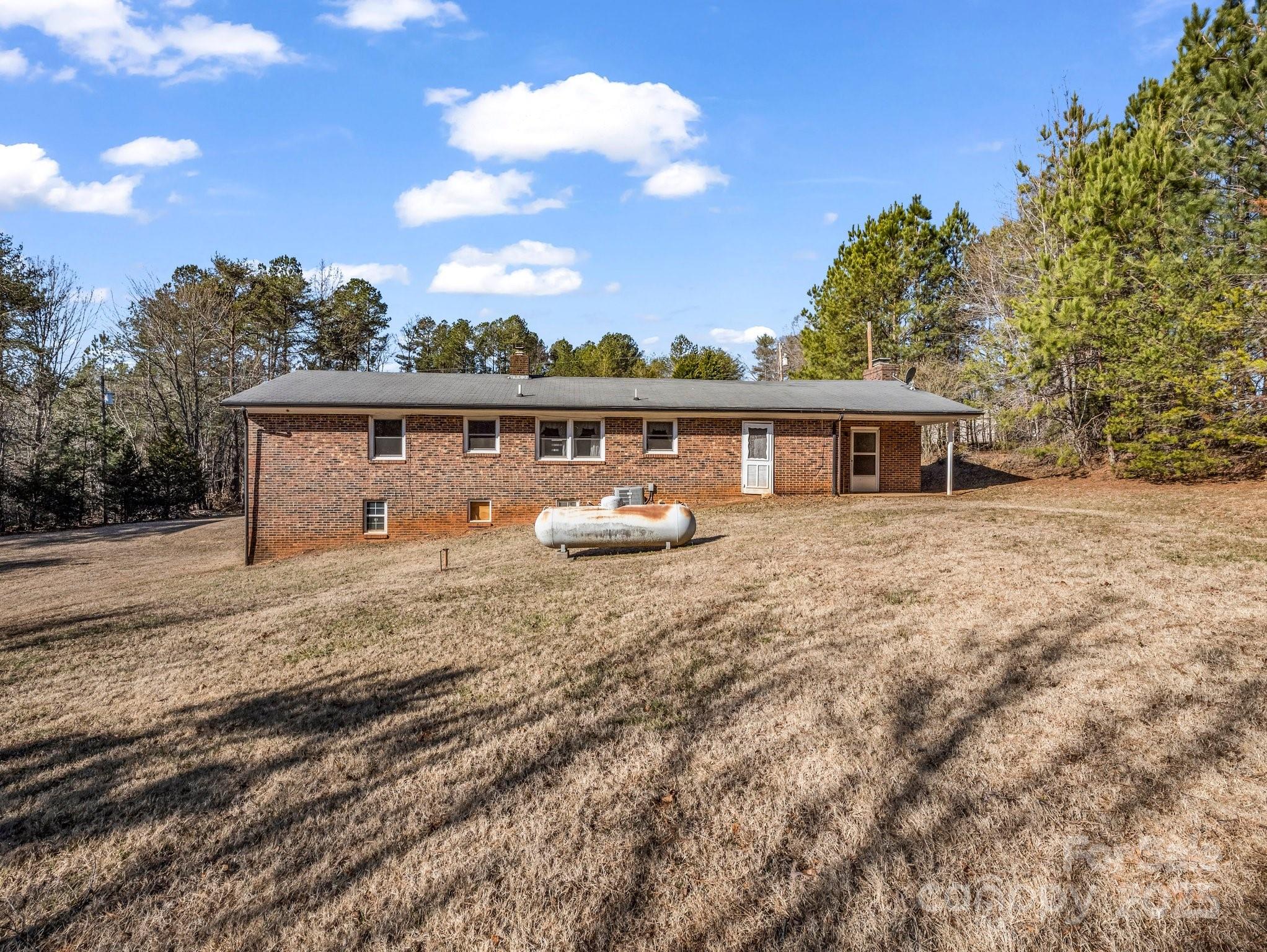 127 Mapp Street Spindale, NC 28160 - Photo 7 of 32 a view of a house with a yard and a garden