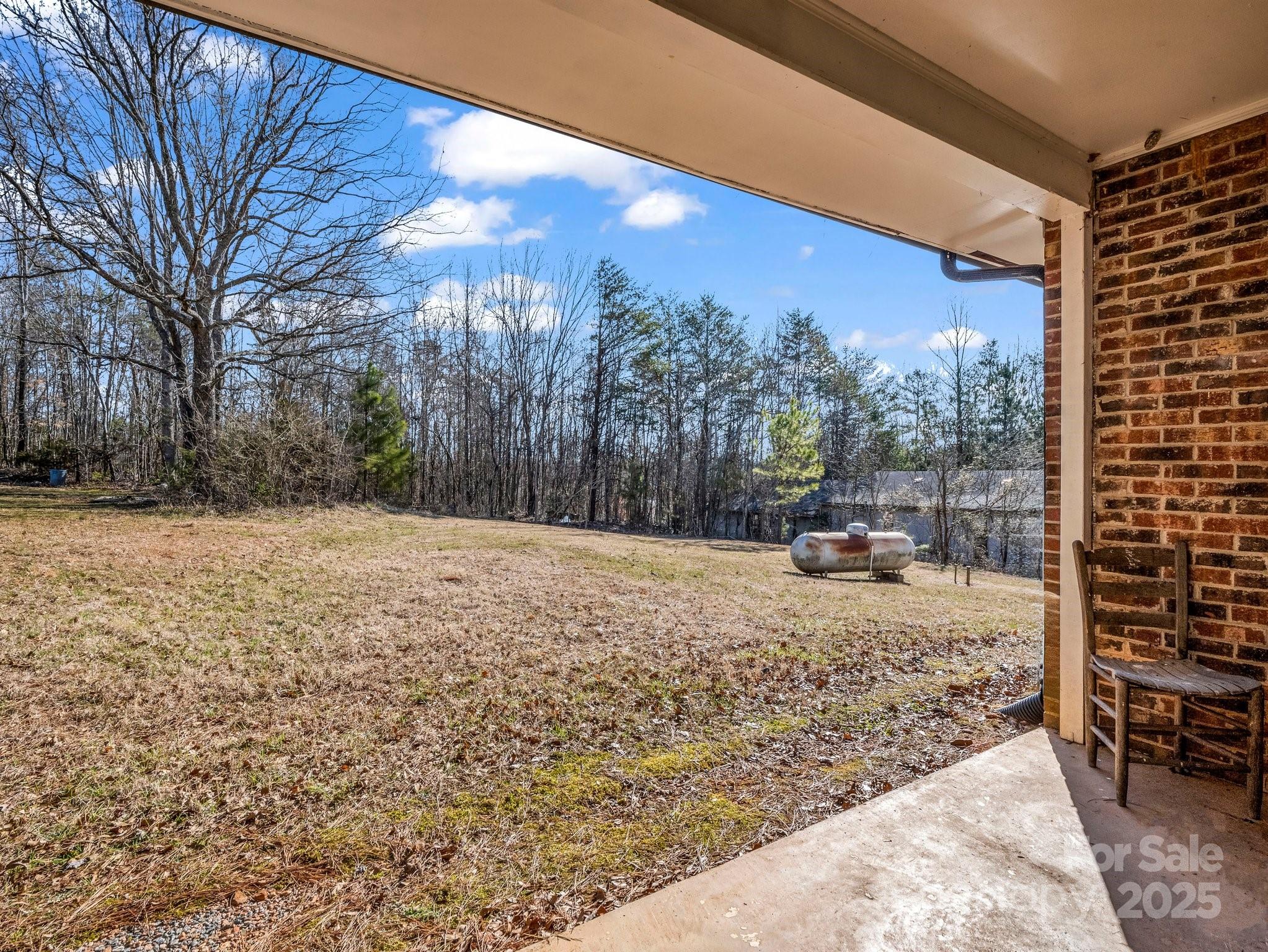 127 Mapp Street Spindale, NC 28160 - Photo 9 of 32 a view of a backyard with large trees