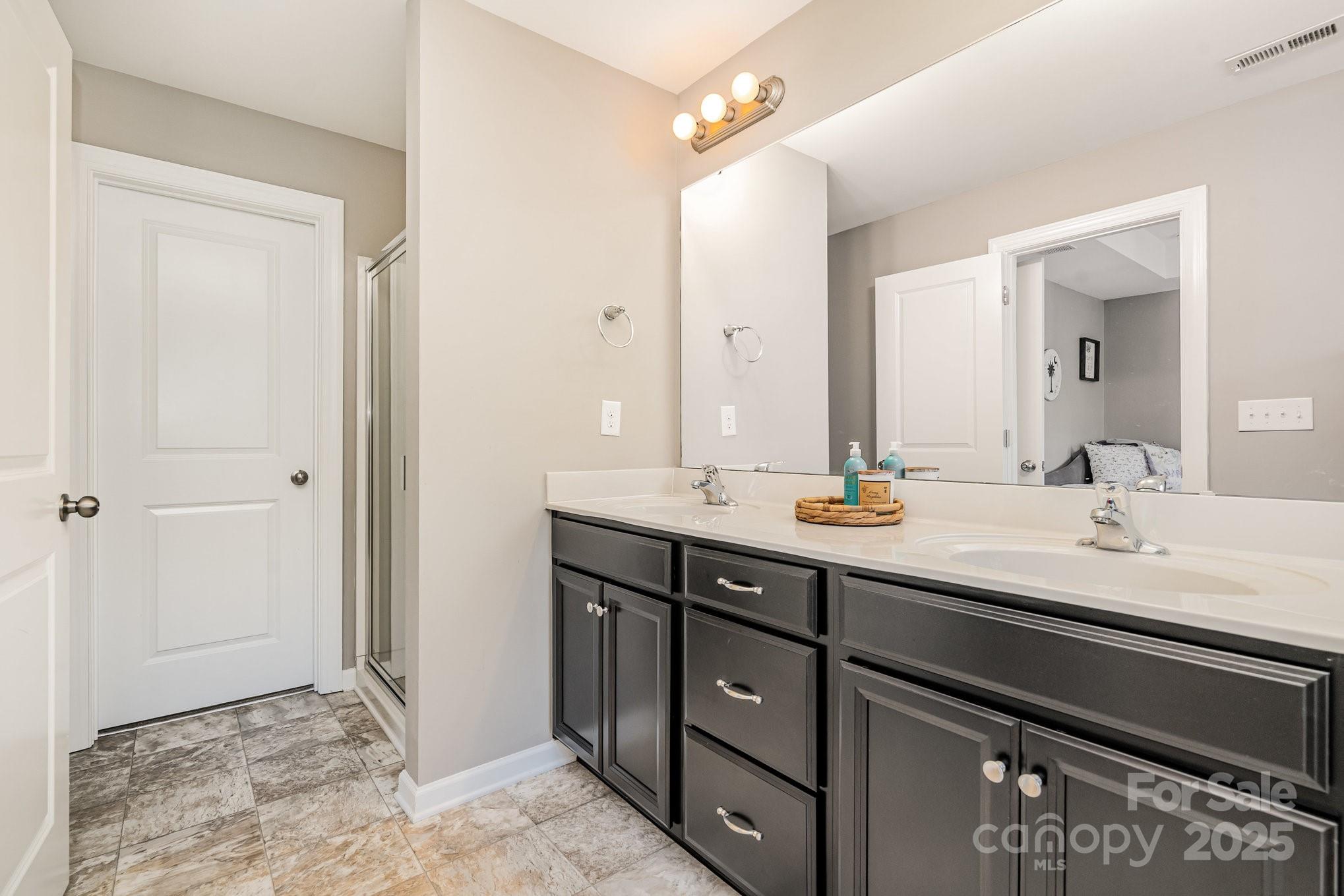 1005 Archibald Avenue Fort Mill, SC 29708 - Photo 23 of 42 a bathroom with a sink and a mirror