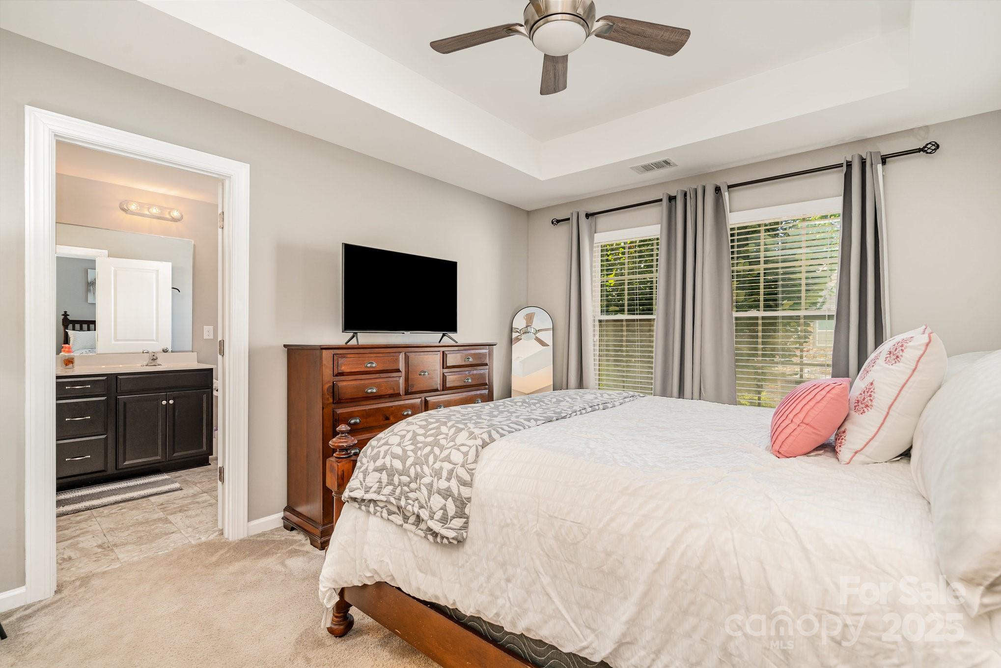 1005 Archibald Avenue Fort Mill, SC 29708 - Photo 24 of 42 a bedroom with a bed and a flat screen tv