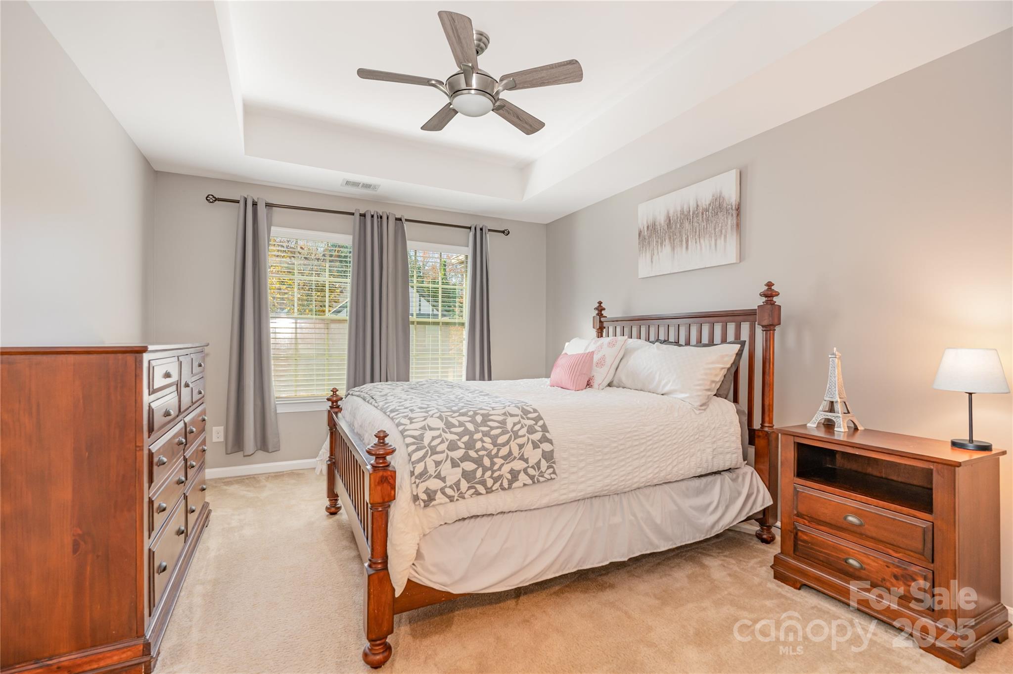 1005 Archibald Avenue Fort Mill, SC 29708 - Photo 5 of 42 a bedroom with a bed and a chandelier