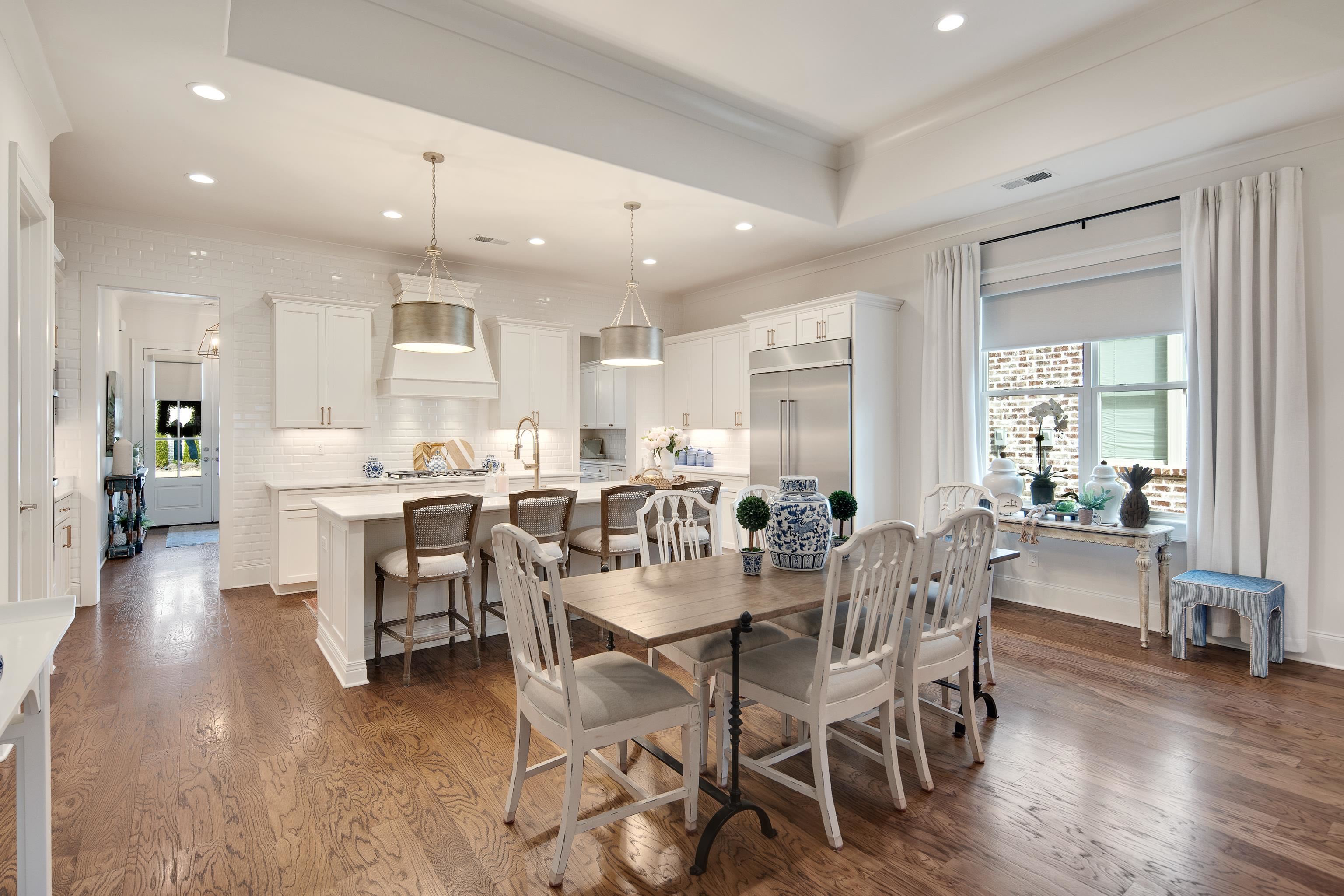 1389 Peyton Parkway Collierville, TN 38017 - Photo 11 of 38 a view of a dining area with furniture and wooden floor