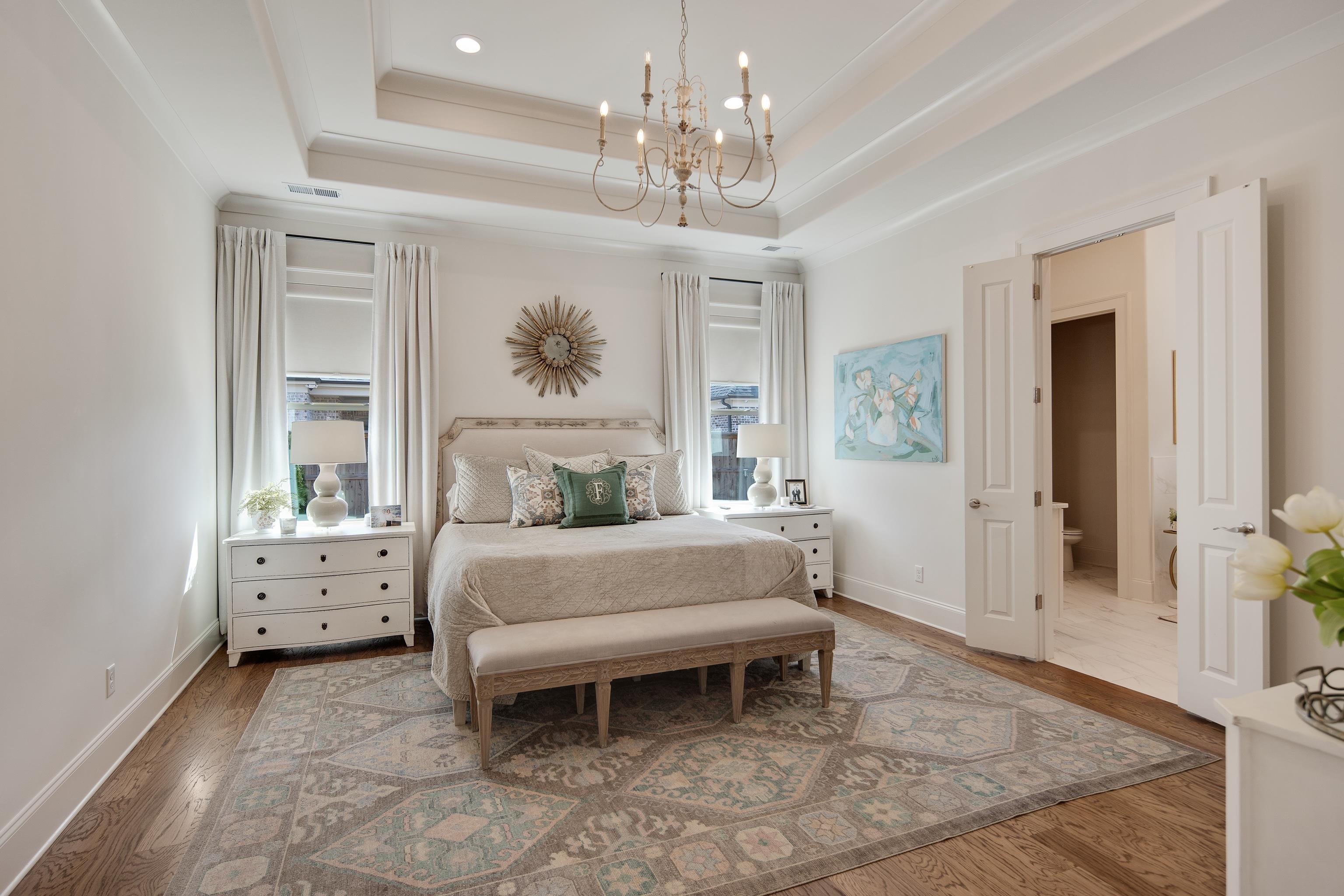 1389 Peyton Parkway Collierville, TN 38017 - Photo 15 of 38 a spacious bedroom with a bed and a chandelier