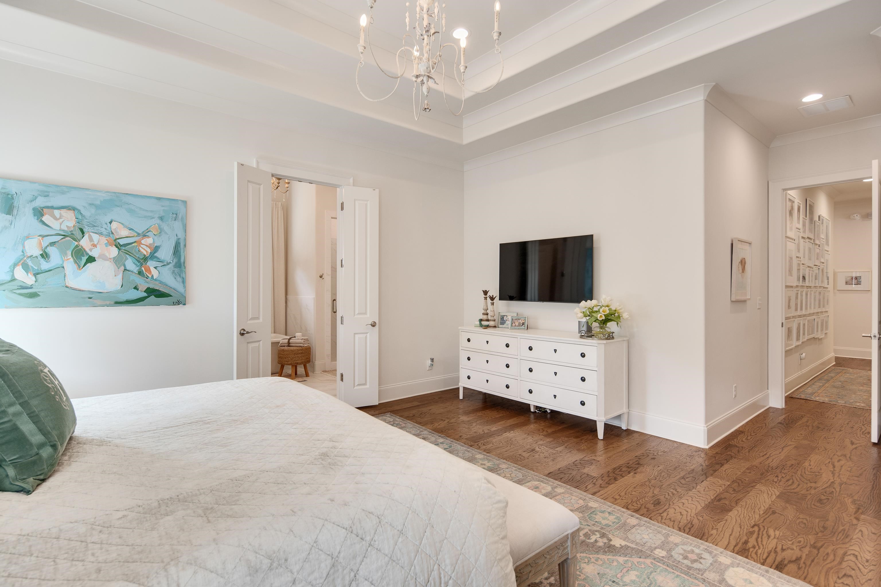 1389 Peyton Parkway Collierville, TN 38017 - Photo 16 of 38 a bedroom with a large bed and a flat screen tv