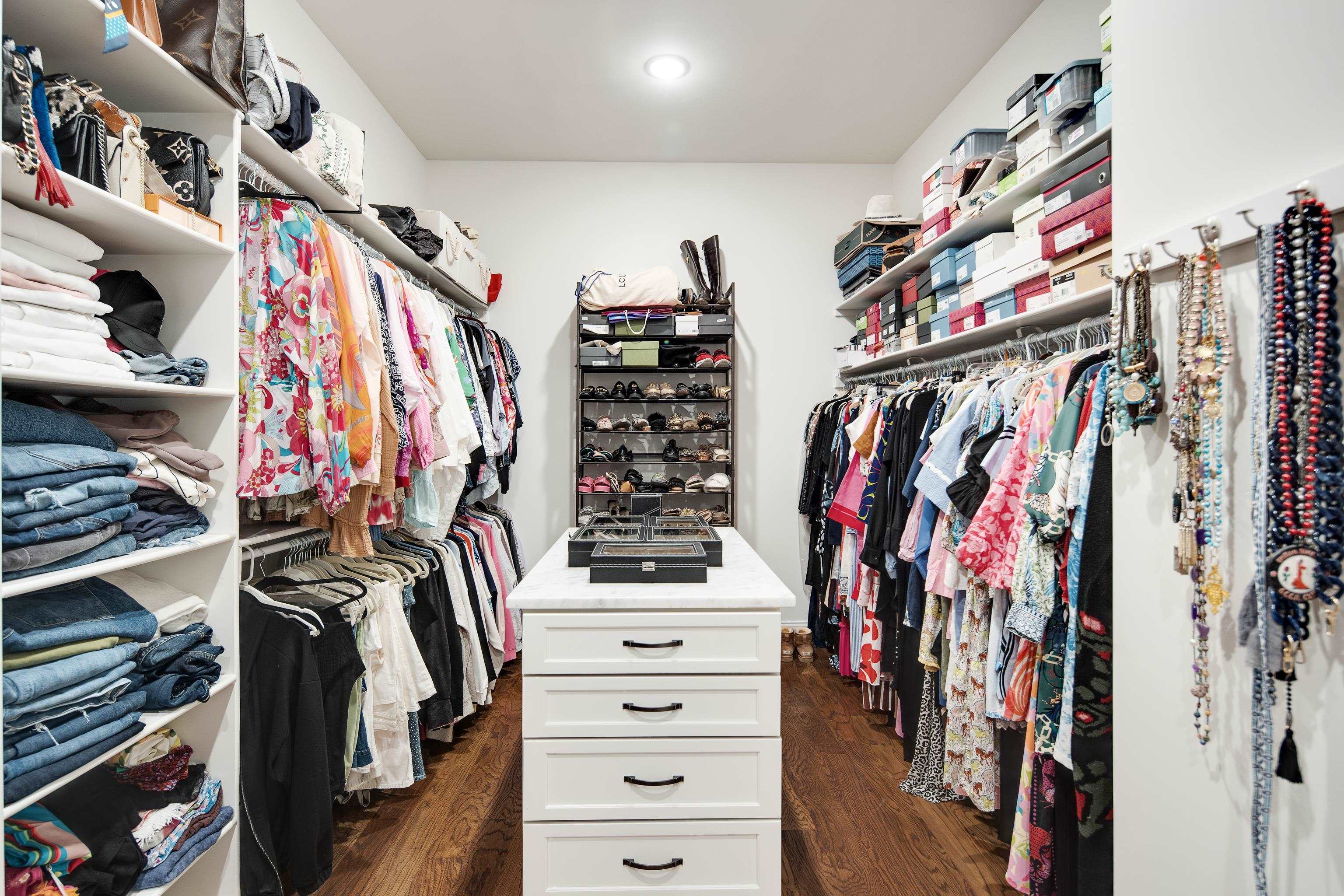 1389 Peyton Parkway Collierville, TN 38017 - Photo 20 of 38 a view of walk in closet with clothes and shoes