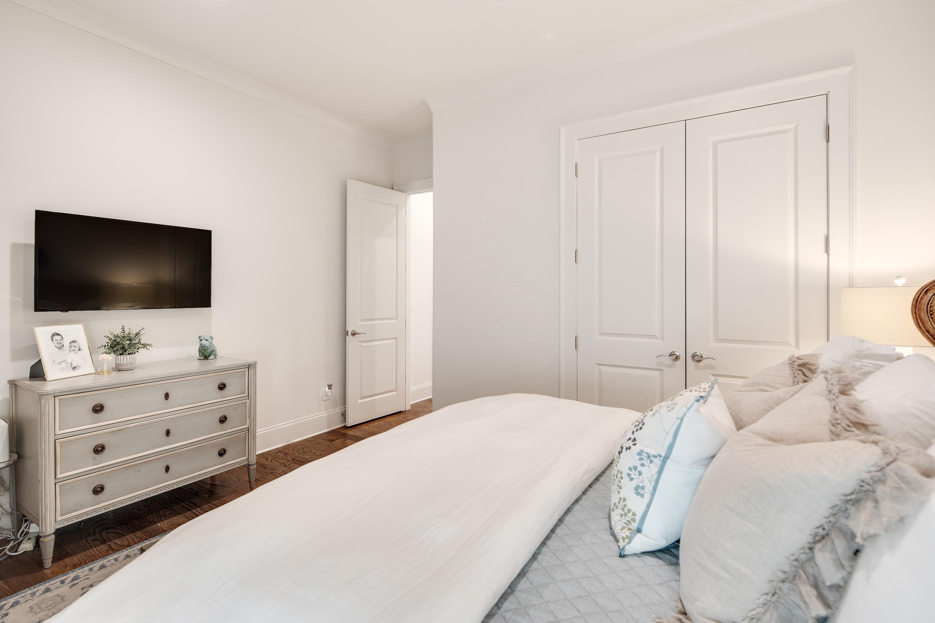 1389 Peyton Parkway Collierville, TN 38017 - Photo 22 of 38 a bedroom with a flat screen tv on the dresser and a flat tv screen on dresser