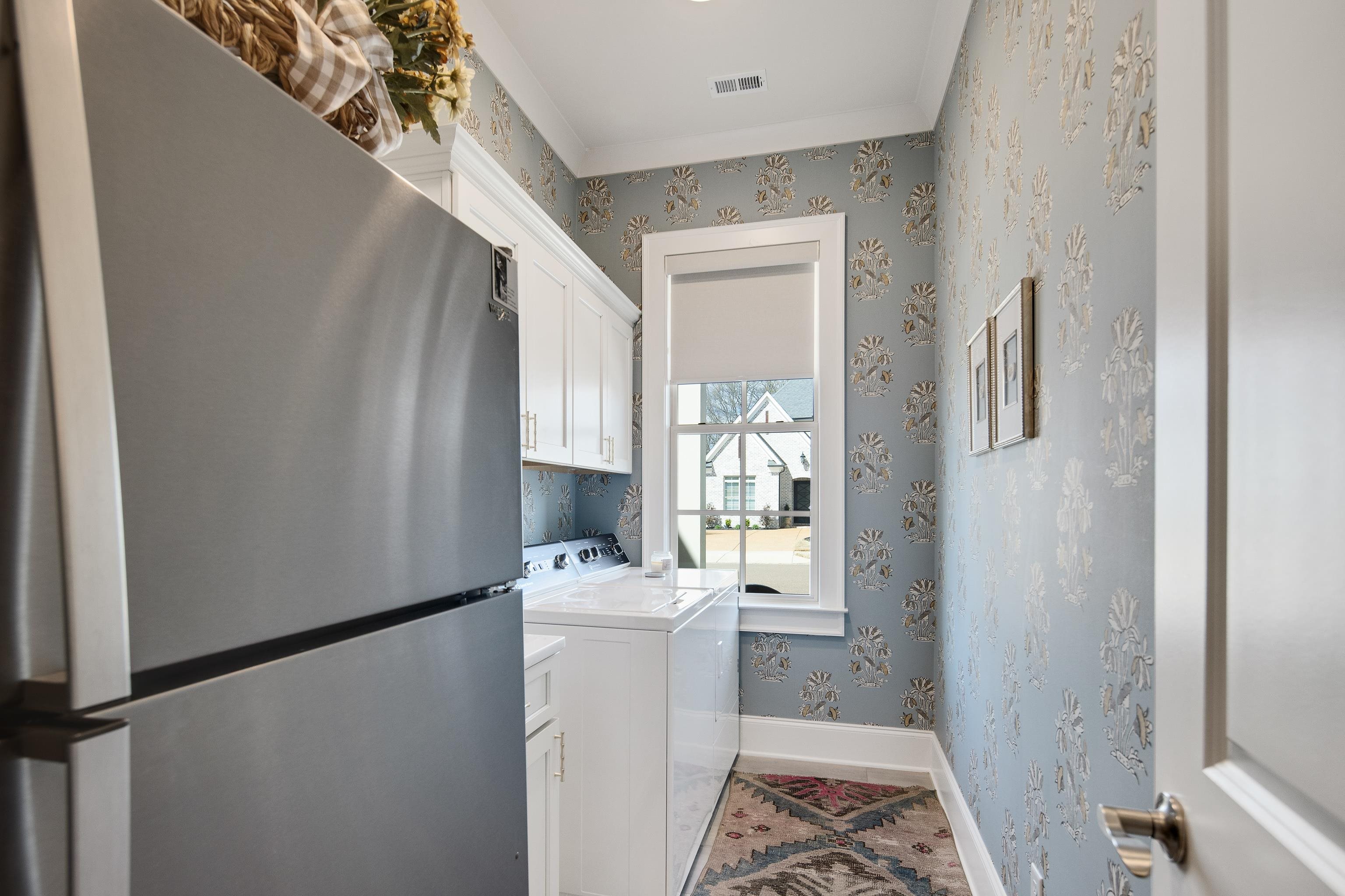 1389 Peyton Parkway Collierville, TN 38017 - Photo 25 of 38 a view of hallway with washer and dryer