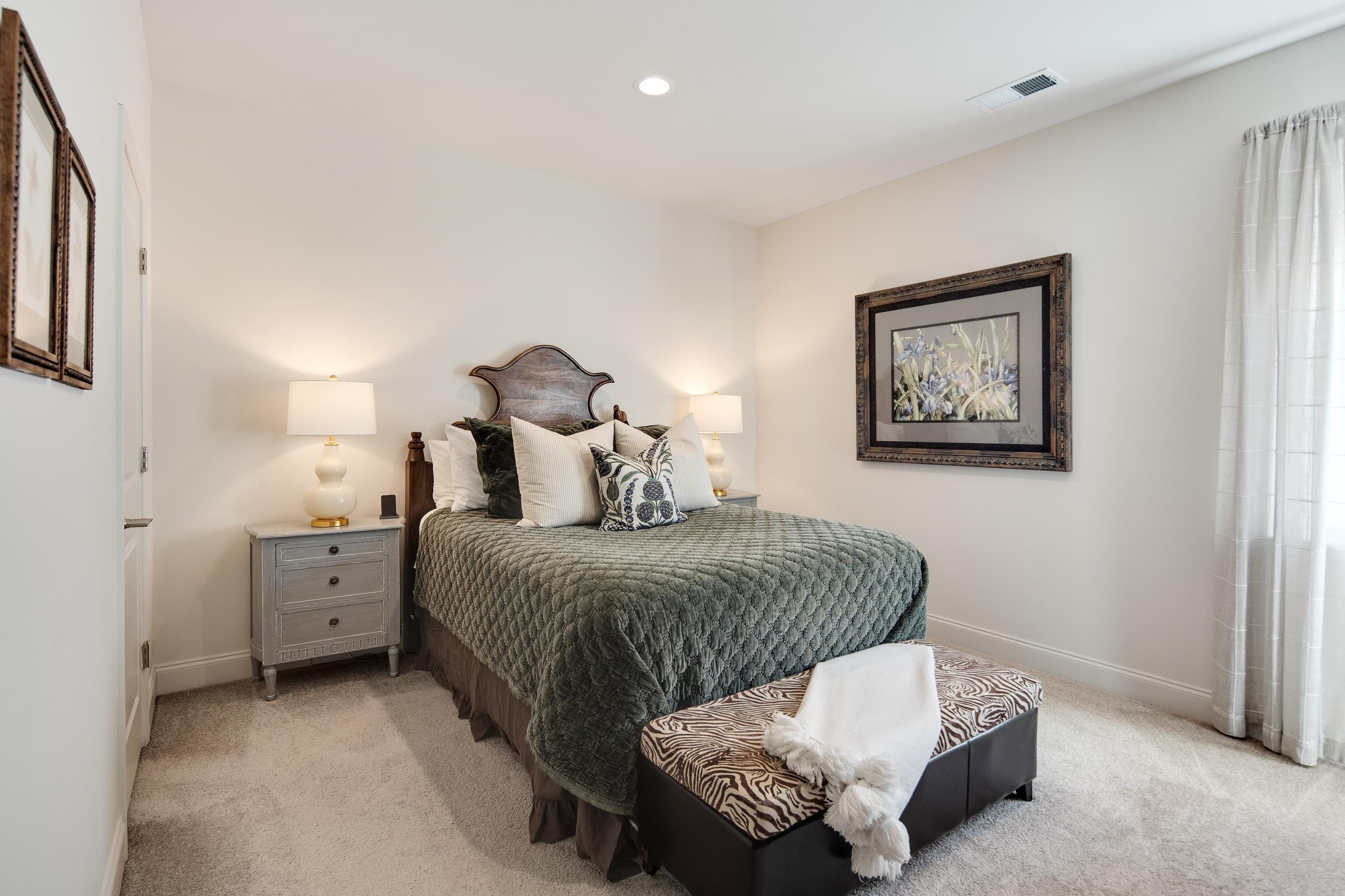 1389 Peyton Parkway Collierville, TN 38017 - Photo 27 of 38 a spacious bedroom with a bed and a chandelier