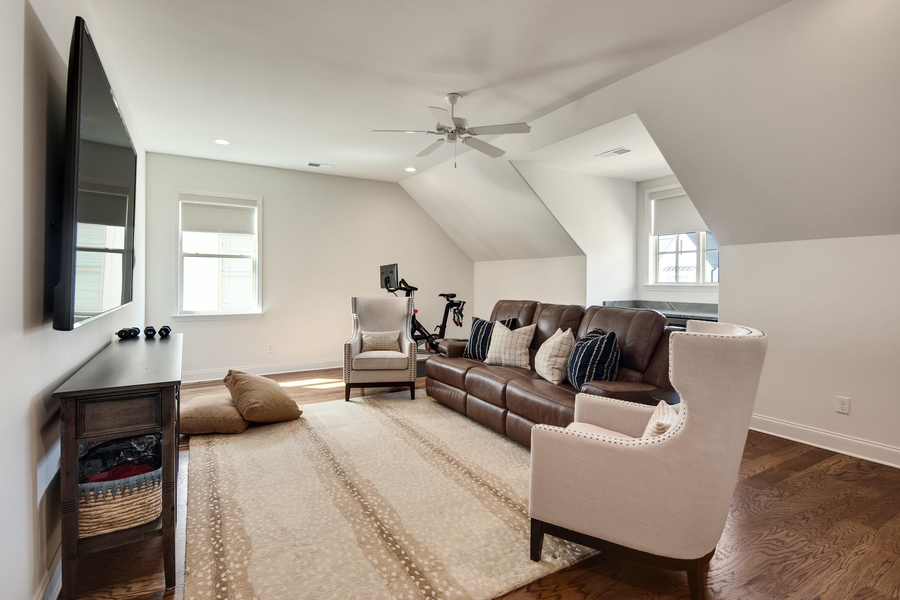 1389 Peyton Parkway Collierville, TN 38017 - Photo 32 of 38 a living room with furniture and a flat screen tv