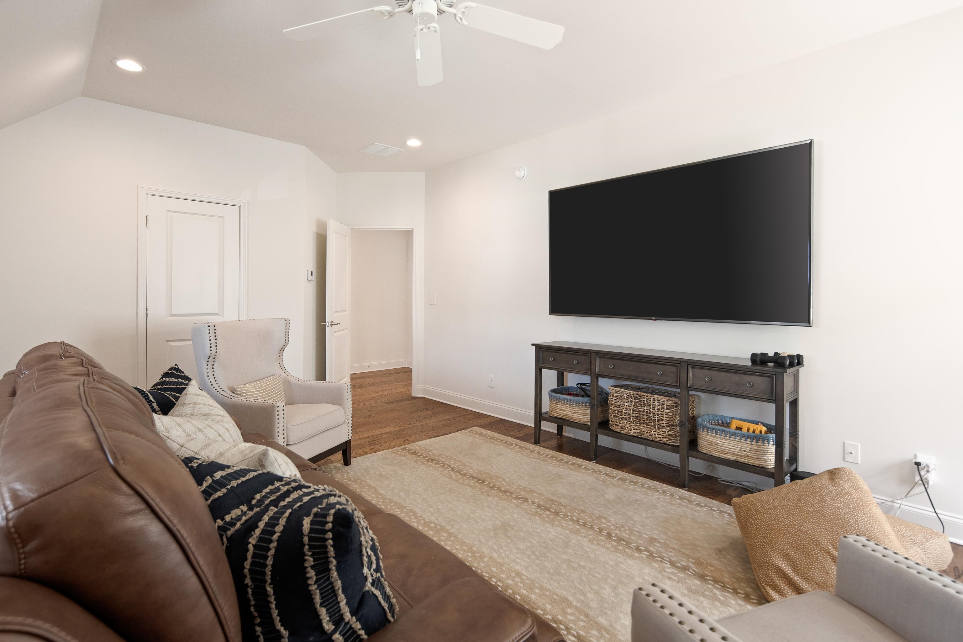 1389 Peyton Parkway Collierville, TN 38017 - Photo 33 of 38 a living room with furniture and a flat screen tv