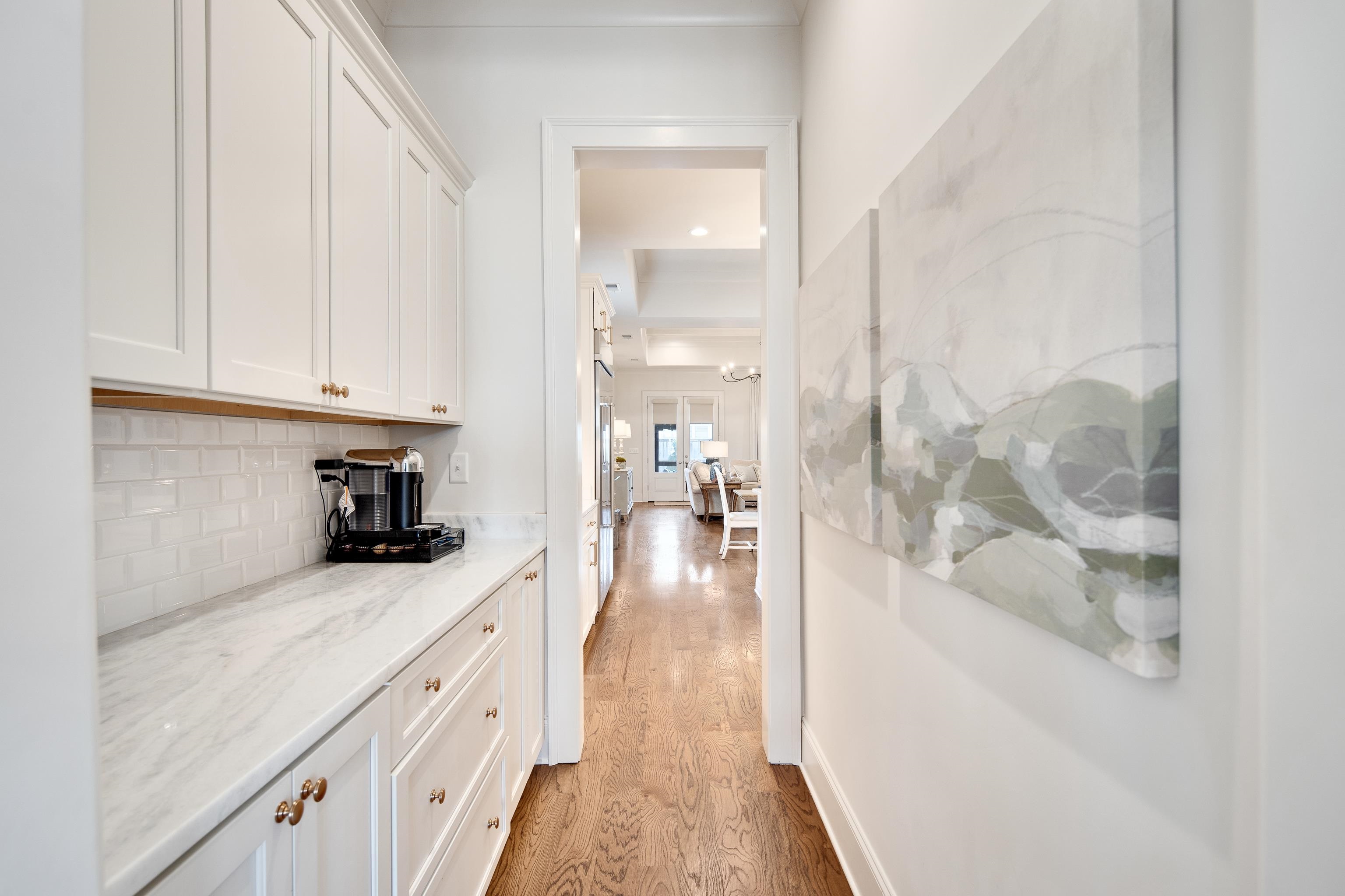 1389 Peyton Parkway Collierville, TN 38017 - Photo 9 of 38 a kitchen with granite countertop white cabinets and white appliances