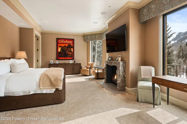 a bathroom with a granite countertop sink a mirror and a shower