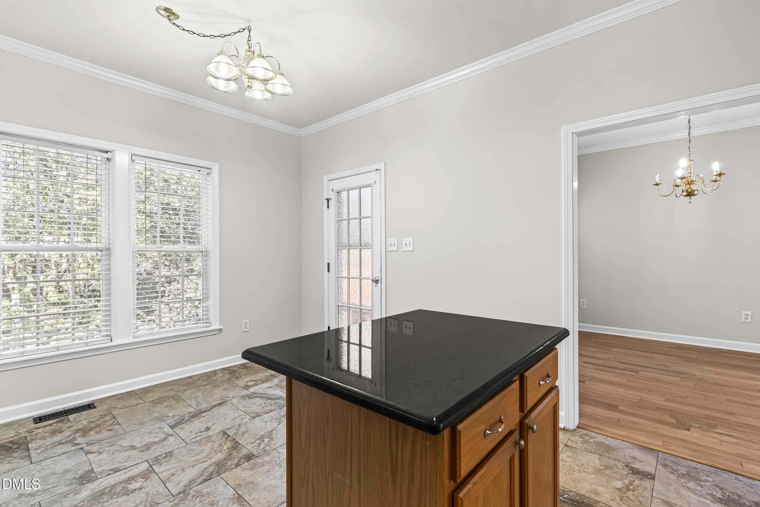4809 Elmhurst Ridge Court Raleigh, NC 27616 - Photo 15 of 46 a view of a room that has a table and chairs in it