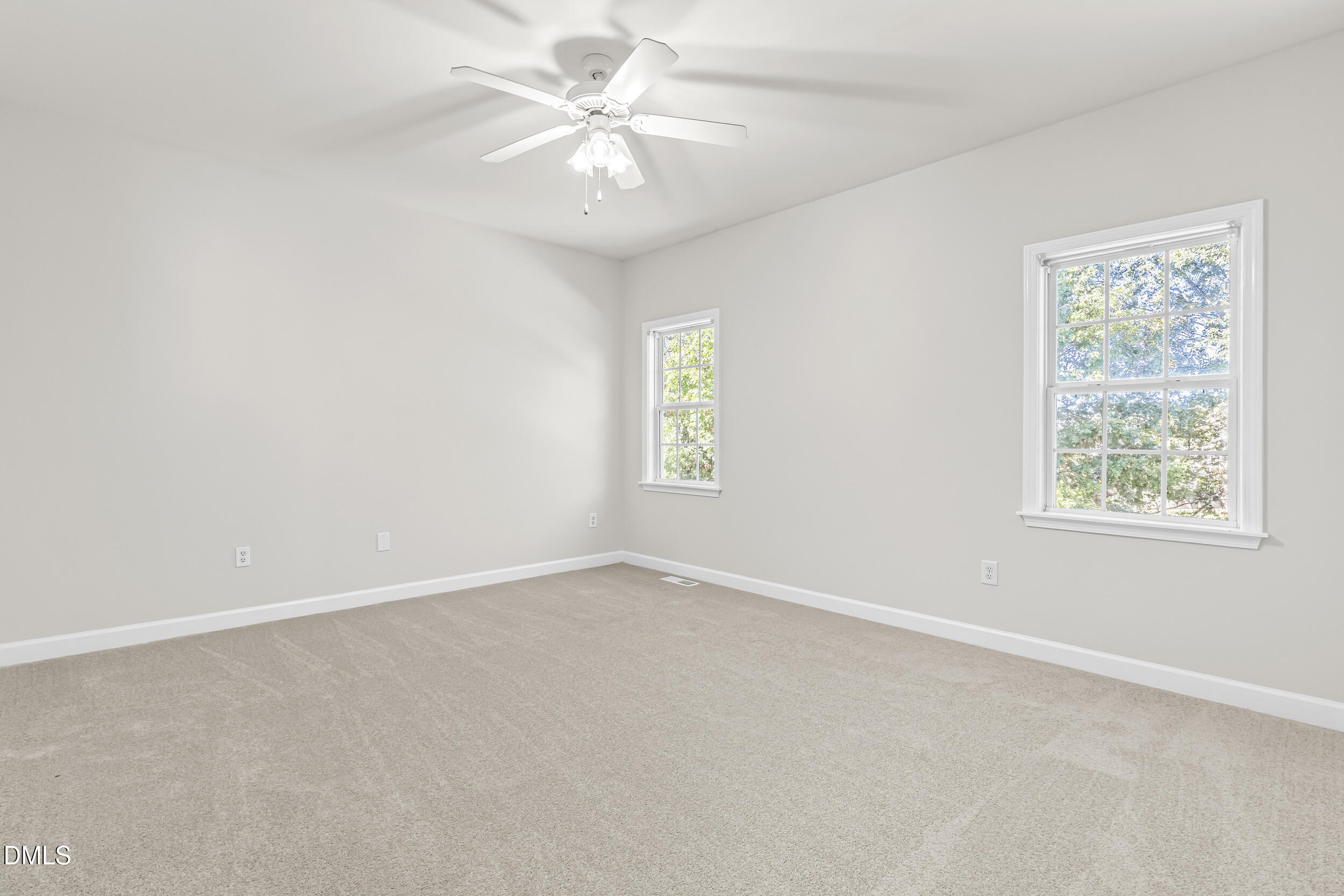 4809 Elmhurst Ridge Court Raleigh, NC 27616 - Photo 17 of 46 an empty room with a window and a fan