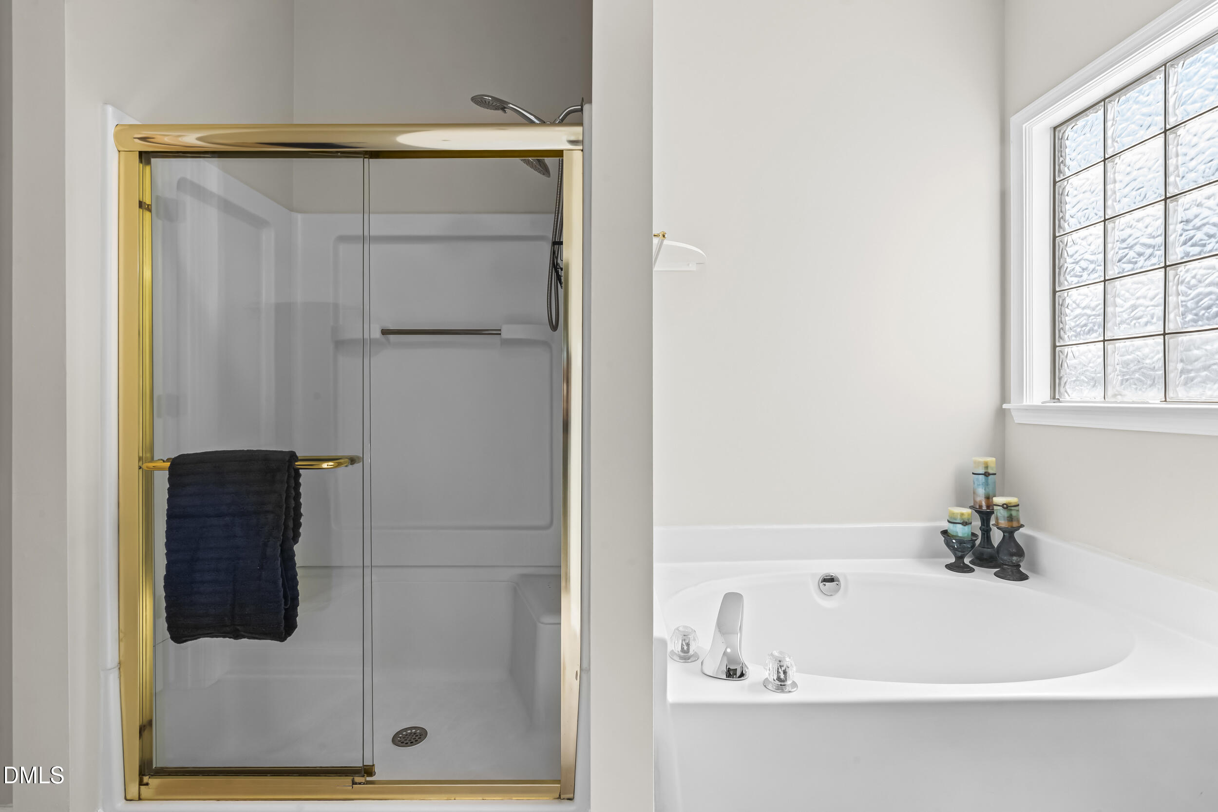 4809 Elmhurst Ridge Court Raleigh, NC 27616 - Photo 21 of 46 a bathroom with a bathtub and a shower