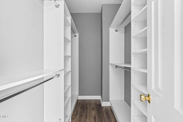 a view of a hallway view with wooden floor and staircase