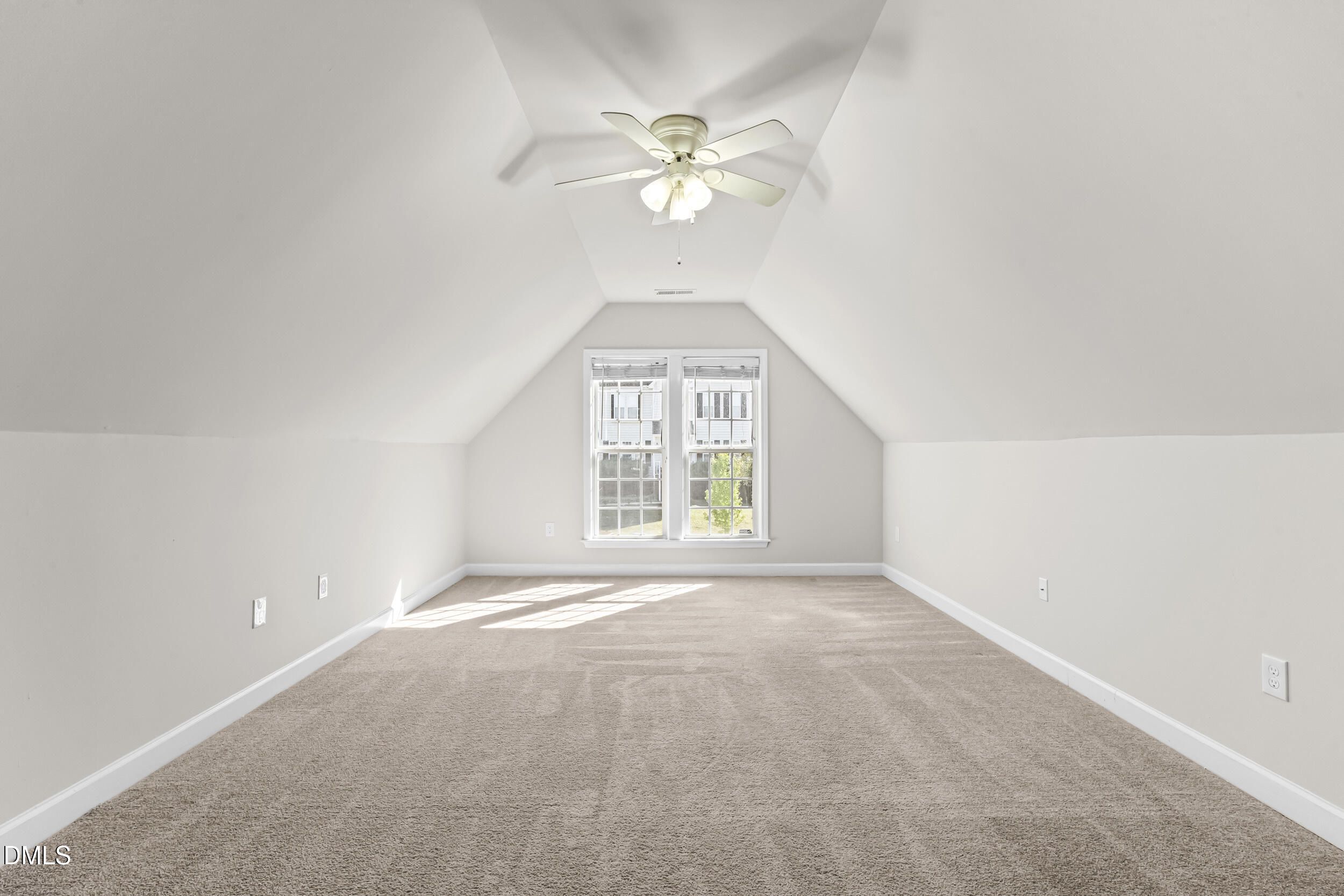 4809 Elmhurst Ridge Court Raleigh, NC 27616 - Photo 26 of 46 an empty room with windows and chandelier fan