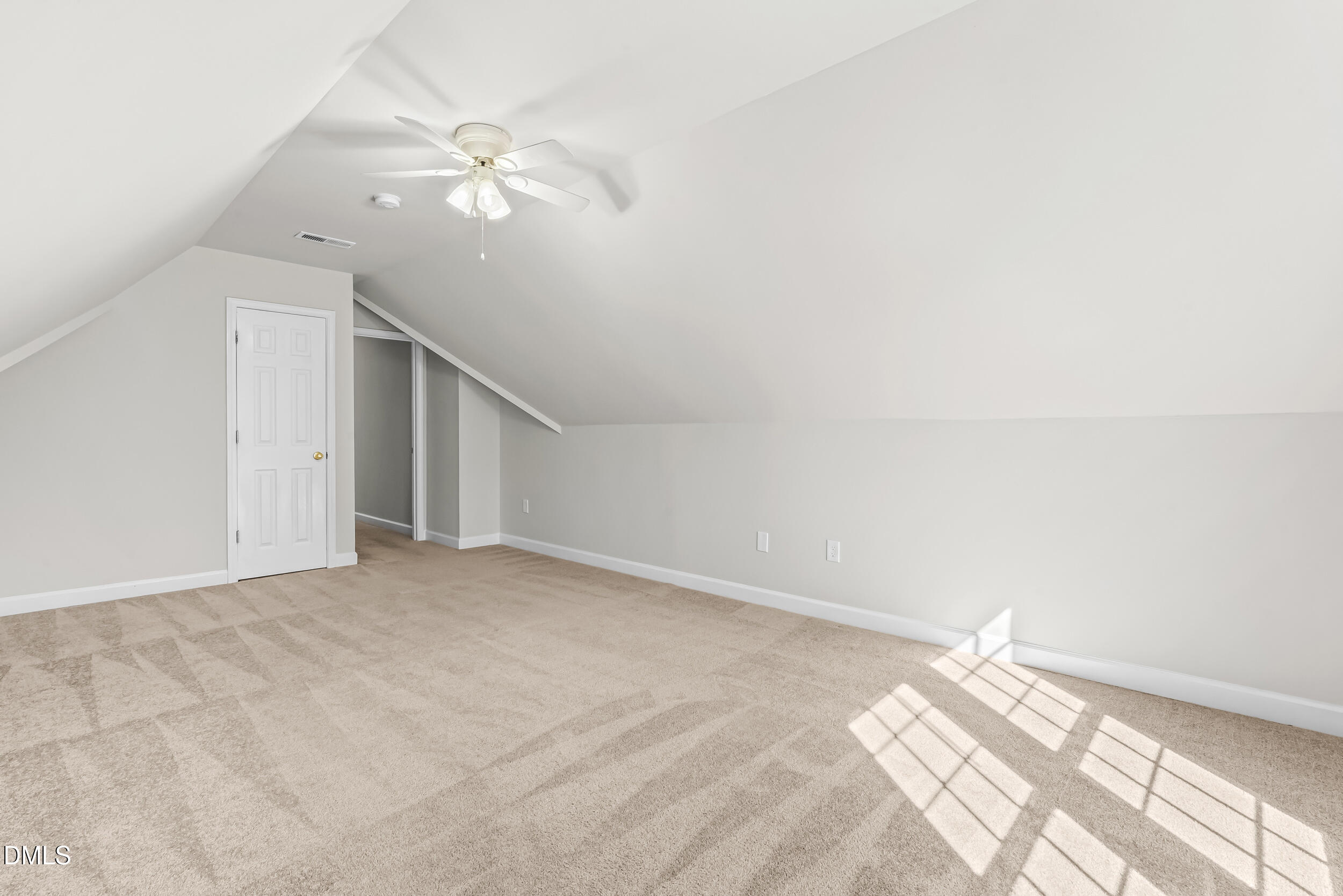 4809 Elmhurst Ridge Court Raleigh, NC 27616 - Photo 27 of 46 en empty room with windows and ceiling fan