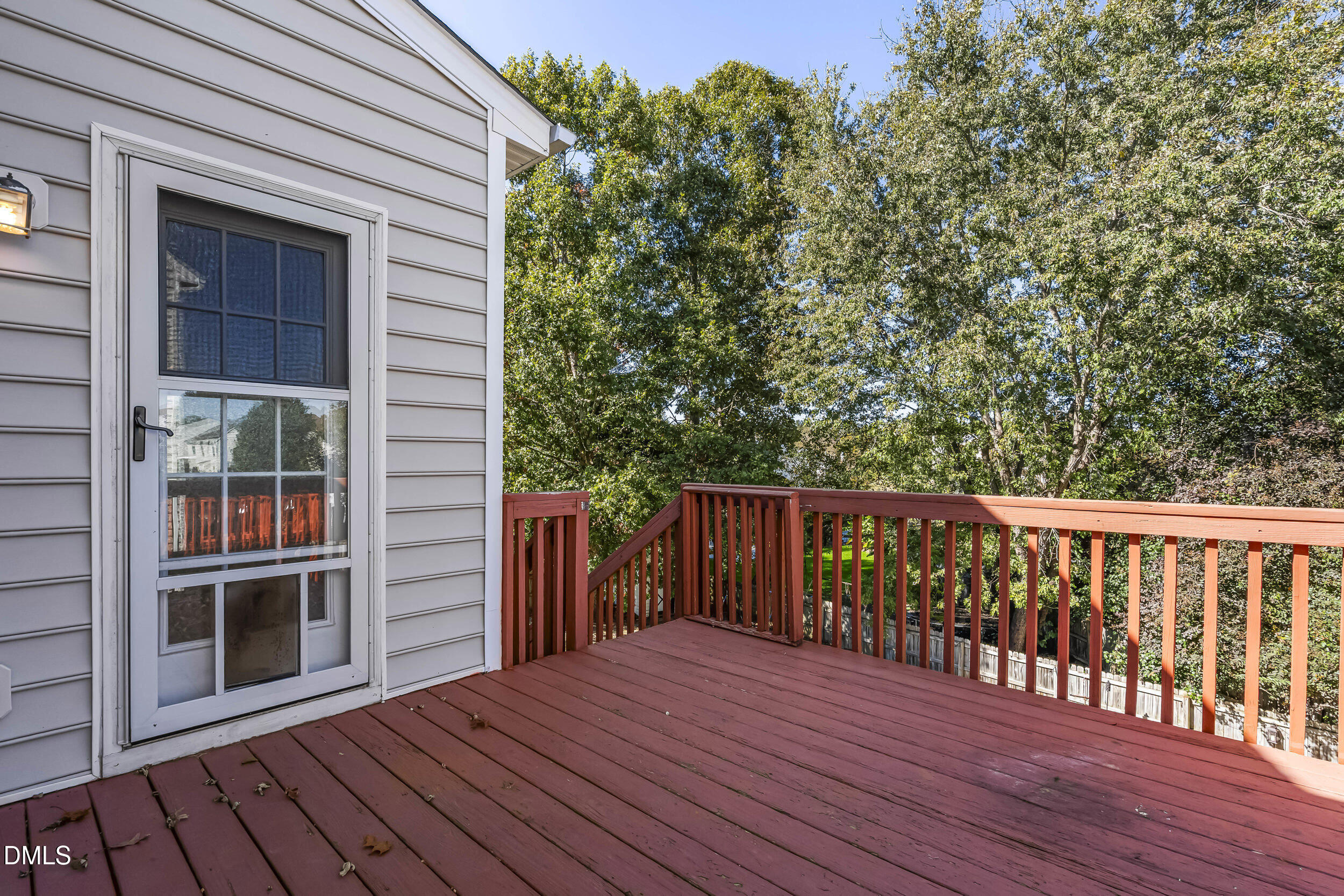 4809 Elmhurst Ridge Court Raleigh, NC 27616 - Photo 40 of 46 a balcony with wooden floor and yard in the back