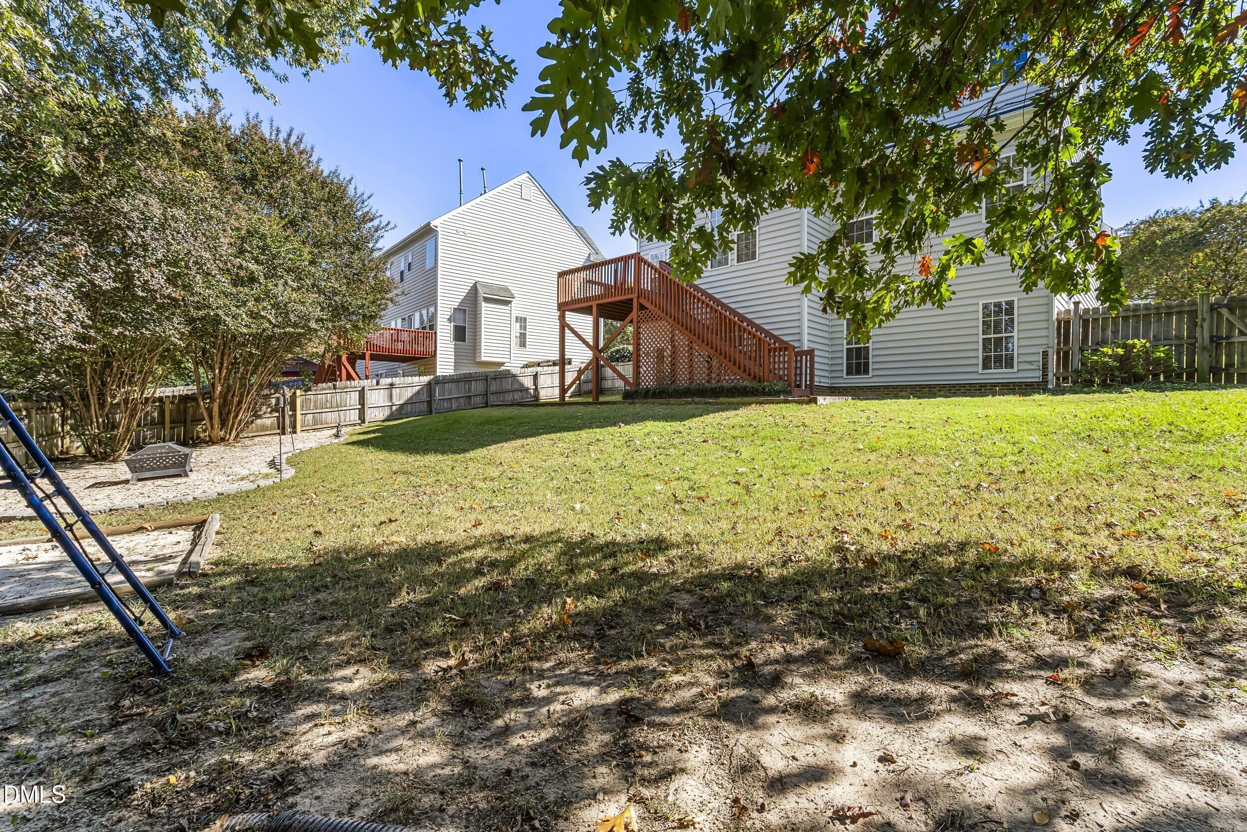 4809 Elmhurst Ridge Court Raleigh, NC 27616 - Photo 44 of 46 a front view of house with yard and trees in the background