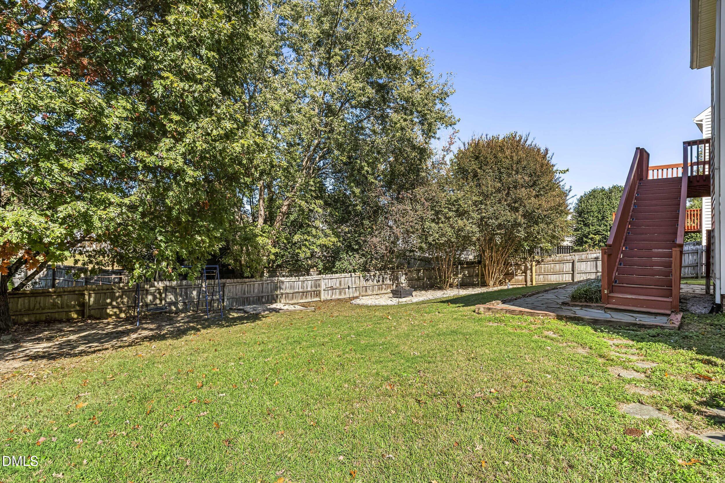 4809 Elmhurst Ridge Court Raleigh, NC 27616 - Photo 45 of 46 a view of a backyard with a large tree