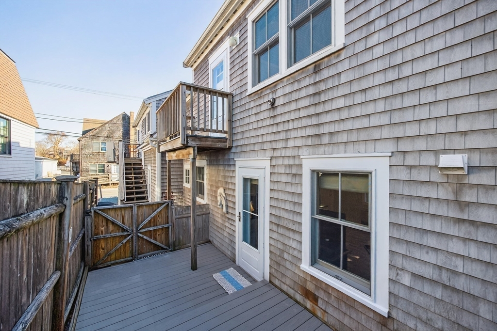 16 Conwell Street, Unit 3 Provincetown, MA 02657 - Photo 20 of 41 a view of a balcony with furniture