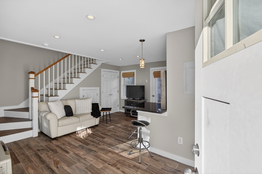 16 Conwell Street, Unit 3 Provincetown, MA 02657 - Photo 23 of 41 a view of entryway and hall with wooden floor