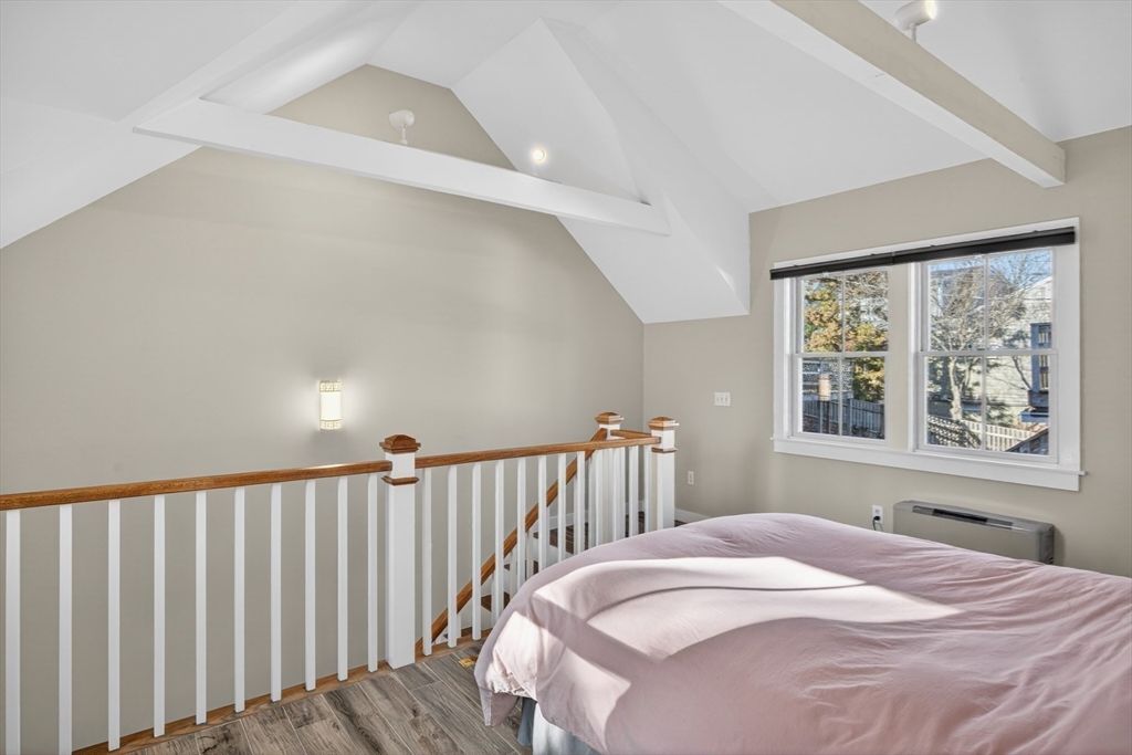 16 Conwell Street, Unit 3 Provincetown, MA 02657 - Photo 26 of 41 a bedroom with a bed and a window