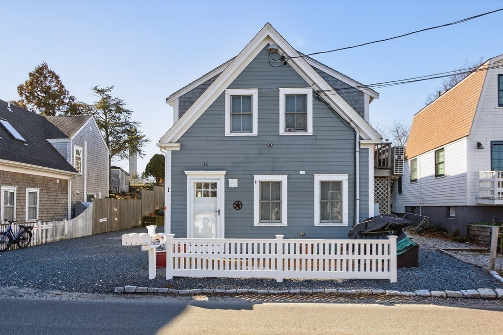 16 Conwell Street, Unit 3 Provincetown, MA 02657 - Photo 41 of 41 a front view of a house with a yard