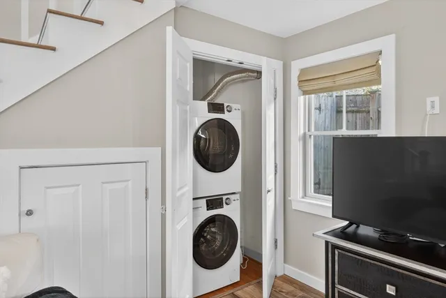 a view of a bedroom with washer and dryer