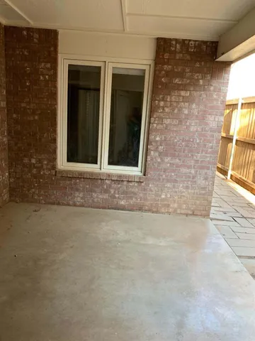view of outdoor space window and front door